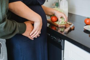 couple cooking together in the kitchen 