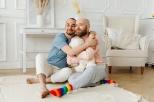 gay couple enjoying with kids 