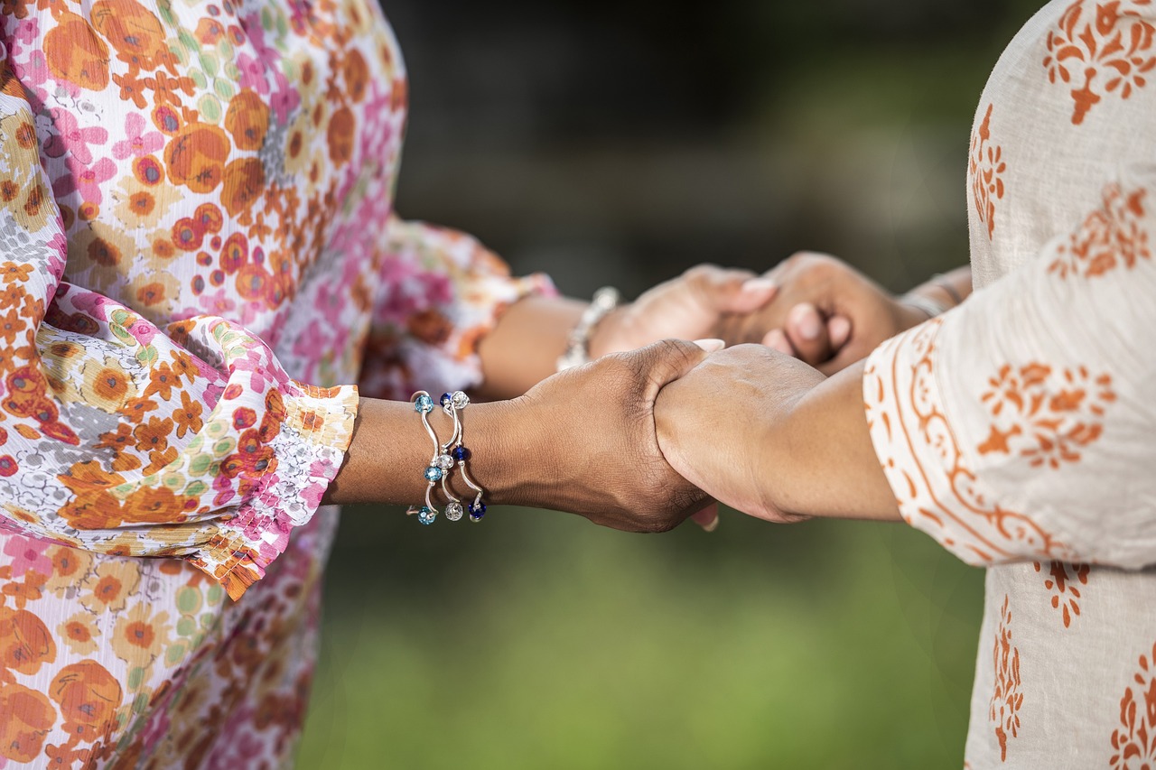 women holding hands 