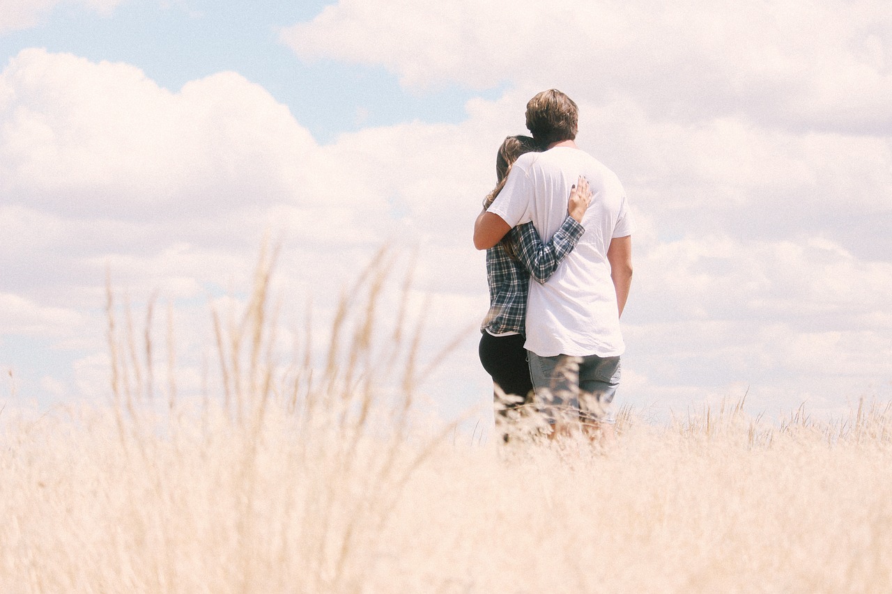 couple hugging outdoors 