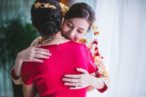 asian women  hug