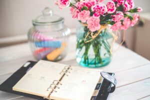 calendar and vase placed on the table