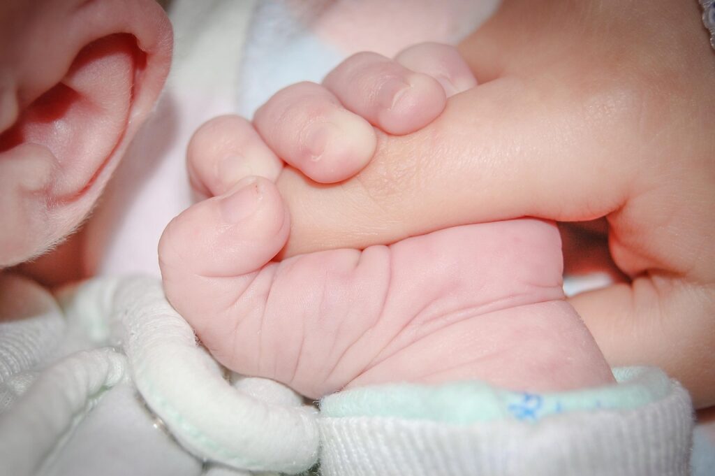 baby-hand-holding-hand 
